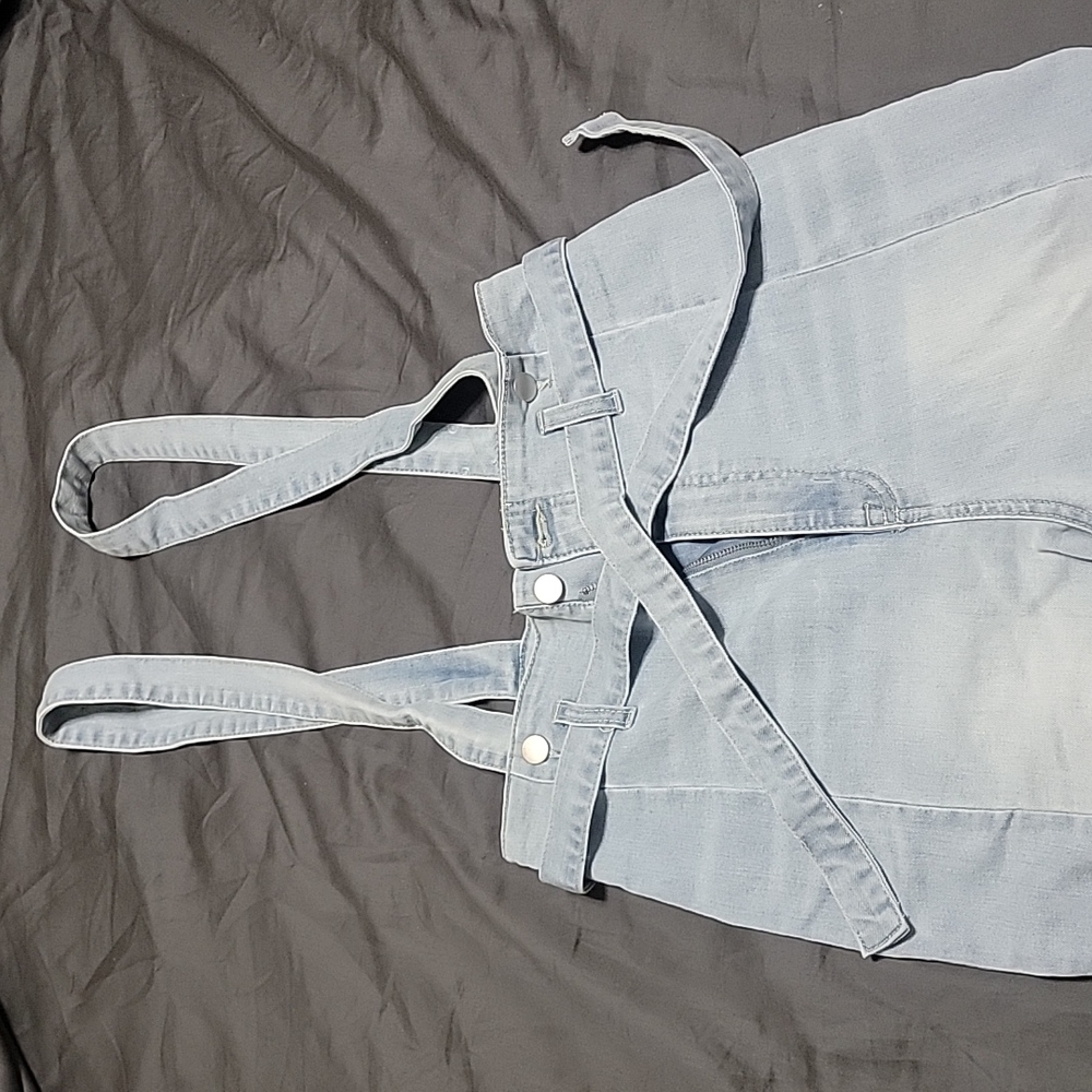 High wasted light denim overalls.